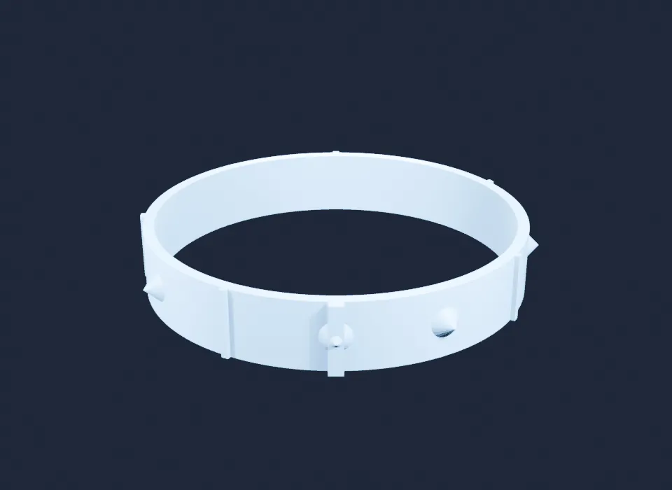 A white plastic bangle at a low angle on a dark blue background, with a wide raised keel facing the camera and small pointed studs at seven of its twelve positions.